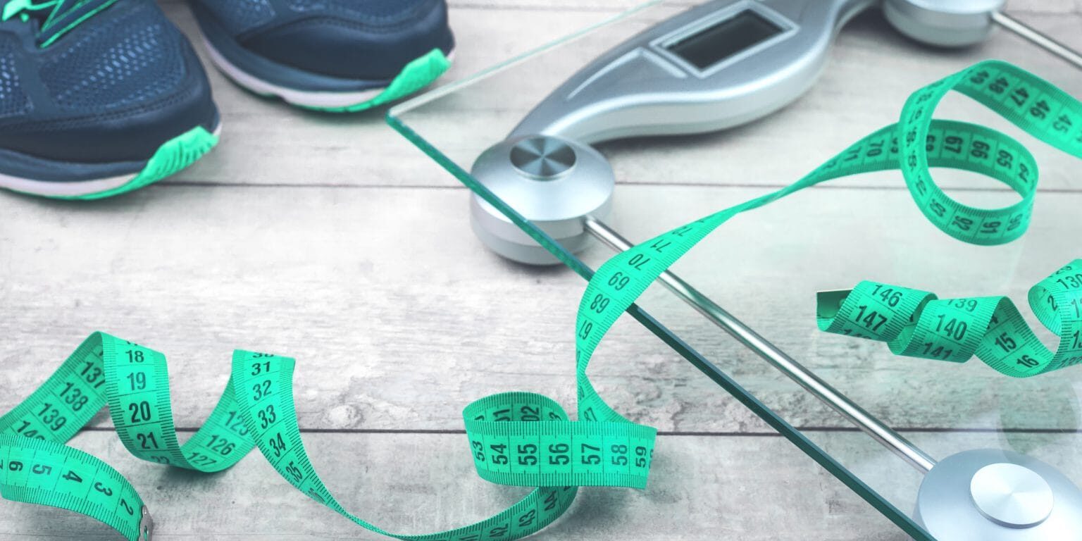Green measure tape, glass weighing scale